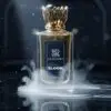 Zamoora Bloom perfume bottle for men floating underwater, surrounded by bubbles, with top notes of bergamot, blood orange and saffron, heart notes of damask rose, jasmine sambac, cinnamon and black tea, and base notes of amber, oud, sandalwood, musk and patchouli