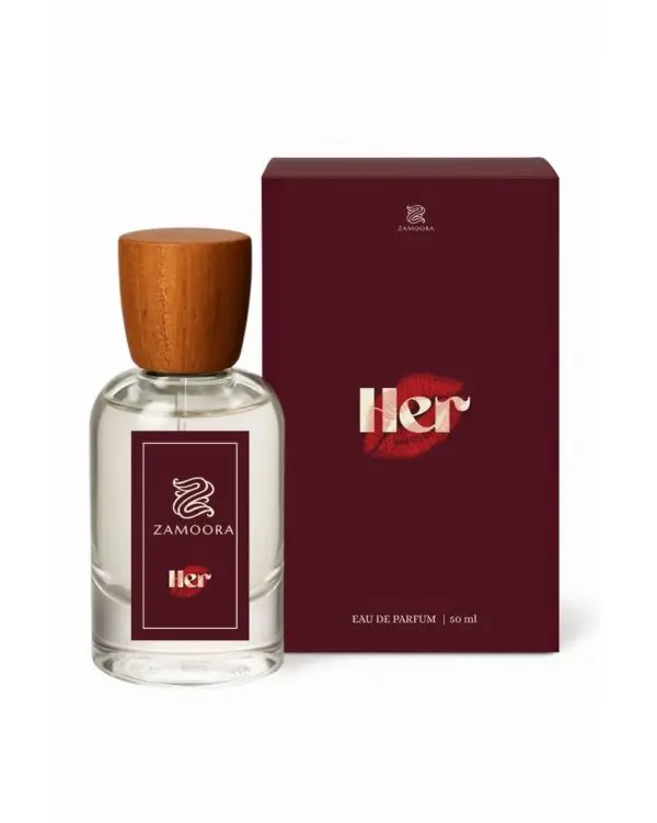 Zamoora HER perfume bottle for women placed among pink flowers with a purple background, highlighting fruity top notes of strawberry, raspberry, blackberry, sour cherry, black currant, mandarin orange and lemon, a heart note of violet jasmine, and base notes of musk, vanilla, cashmeran, woody notes, amber, oakmoss and patchoulI.