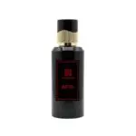 Zamoora Aero men’s perfume bottle displayed on a light wooden stand against a bold red background, featuring top notes of watermelon, red fruits, lavender and Sicilian orange, heart notes of lily of the valley, lotus and jasmine, and base notes of sandalwood, white musk and ambroxan.