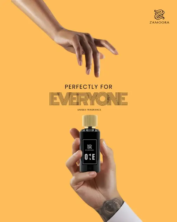 Zamoora One unisex perfume bottle on a glowing golden podium with a warm background, showing top notes of frankincense, cardamom, mandarin oil and apple, heart notes of lavender, caramel, orange blossom and rose, and base notes of Madagascar vanilla, musk, guaiac wood, ambrox and norlimbanol.